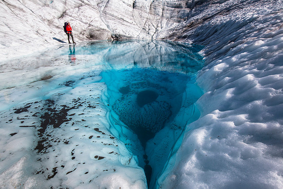 Backpackers Exploring a pool on the Root Glacier (2)