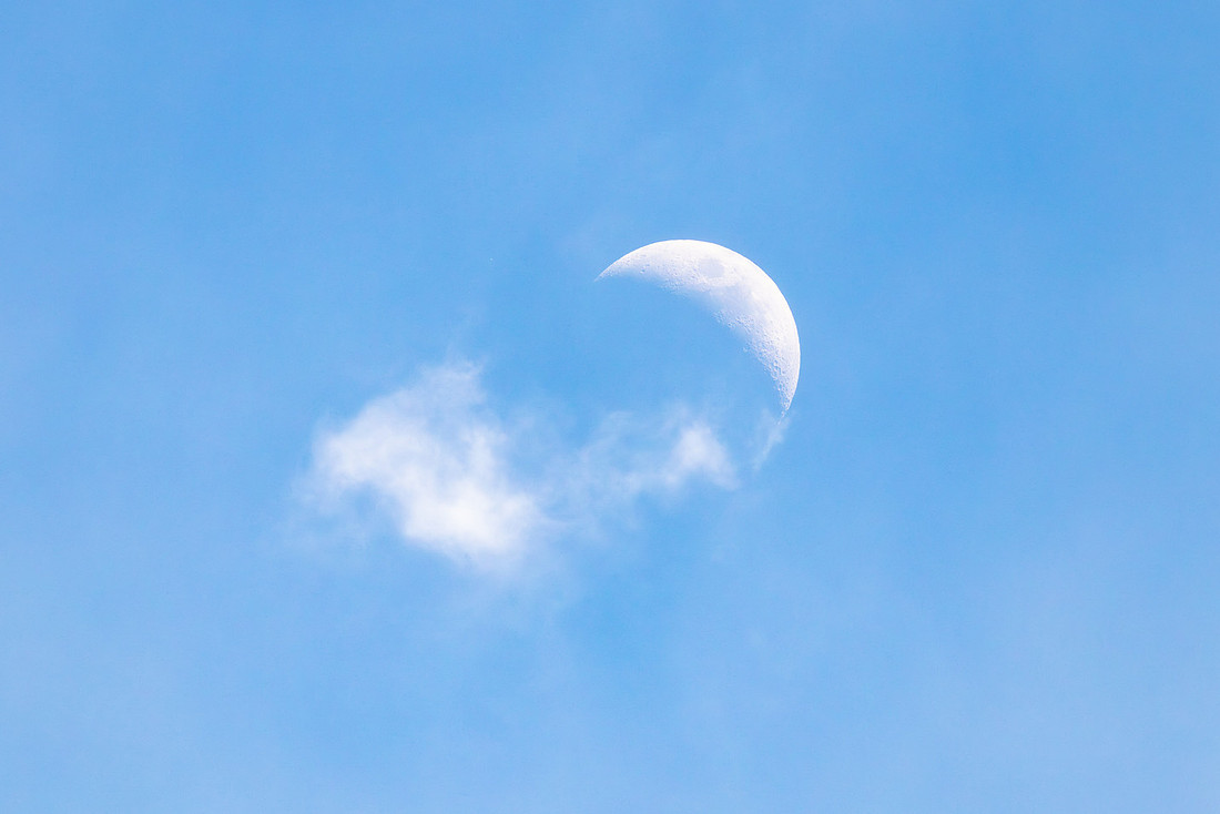 Waxing crescent moon above Mary Lake