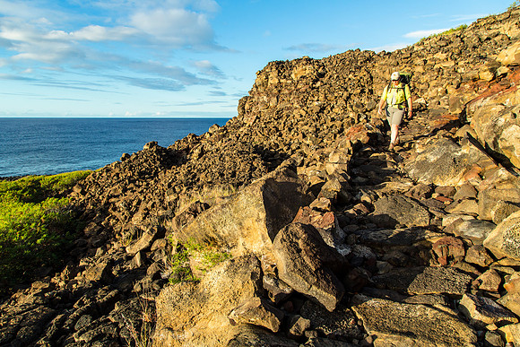 Backpacker on the CCC wall to Keahou
