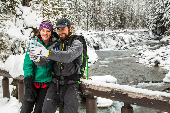 Winter Visitors Taking a photo at Sacred Dancing Cascades