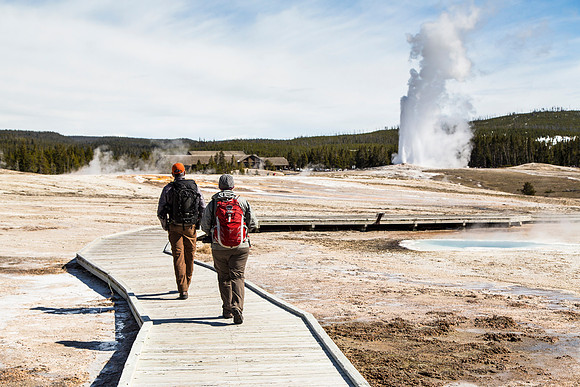 Hikers and Old Faithful