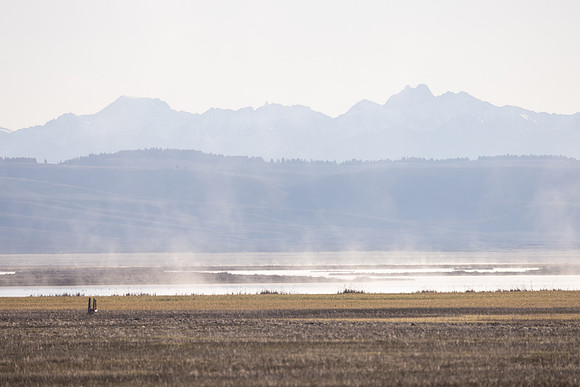 Steam rises from Lower Red Rock Lake at sunrise