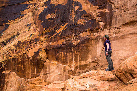 Hiker viewing the petroglyphs