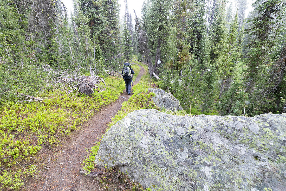 Backpacker in a summer snow storm near Grants Pass