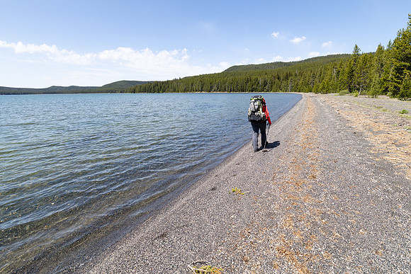 Backpacker along the North Shore Shoshone Lake Trail